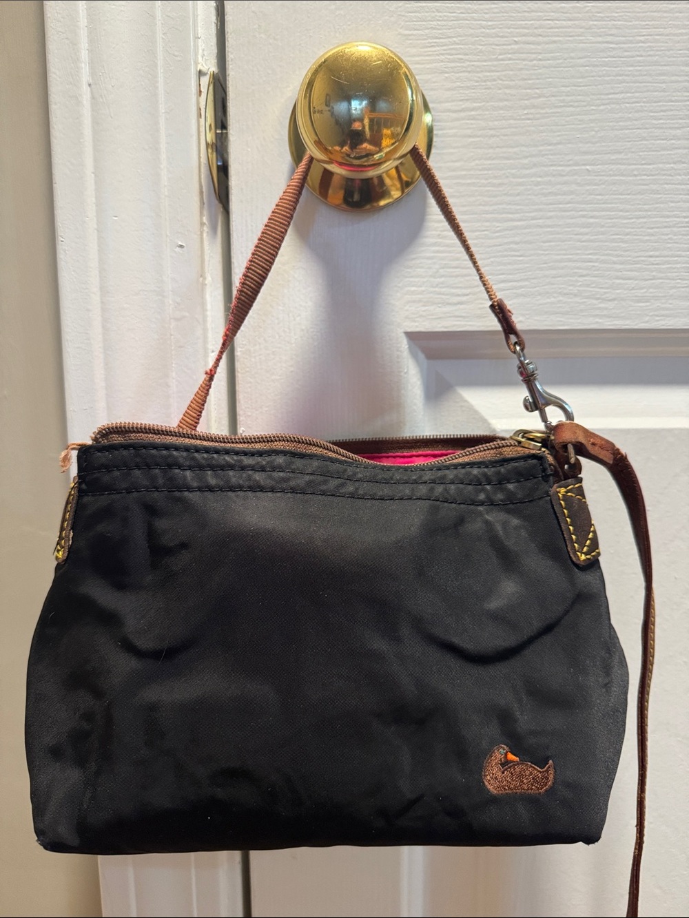 Dooney & Bourke Black Wristlet with Brown Trim